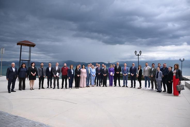 Group photo of participants from Albania and North Macedonia on the shores of Lake Ohrid