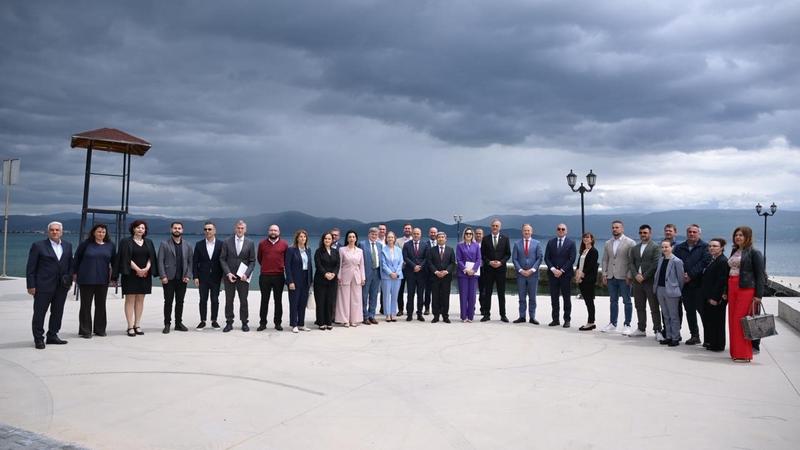 Group photo of participants from Albania and North Macedonia on the shores of Lake Ohrid